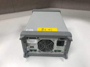 High-quality power supply unit with cooling fan and connection ports for testing.