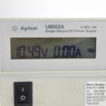 High-precision Keysight U8002A DC power supply displaying 10.49V and 0.00A. Ideal for testing and la.