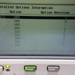 Keysight E4433B signal generator display showing installed options and revisions.