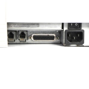 Close-up of Tektronix TM5006 mainframe showing GPIB port and power connection.