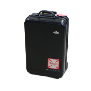 Durable black test equipment case with "Fragile" label for sensitive instruments.