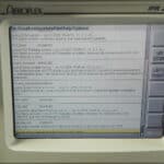Close-up of Aeroflex IFR 2975 communication service monitor screen displaying system options.
