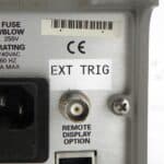 Close-up of Keithley 2304A power supply external trigger port and labels.