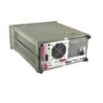 Network analyzer device with cooling fan and pink protective caps on ports.